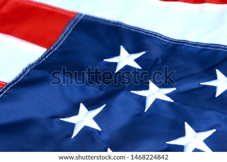 Star and stripes, flag of United States of America. Symbol of freedom and democracy. Selective focus. Close-up.