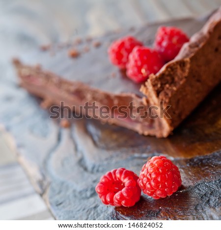 slice of chocolate cake with raspberry