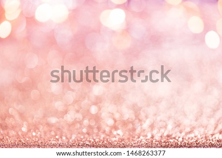 Christmas background. Abstract pink rose gold holiday panoramic backdrop with Defocused glitter, Blinking Stars and lights. Blurred Bokeh