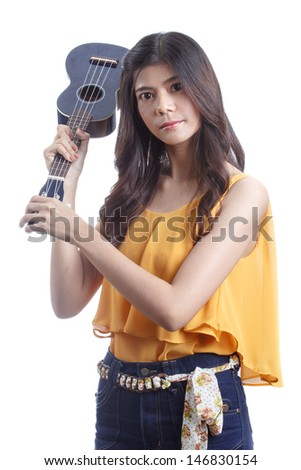 Asian woman holding angry ukulele in hand.