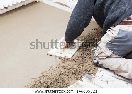 mason smooth the cement screed with trowel Royalty-Free Stock Photo #146835521