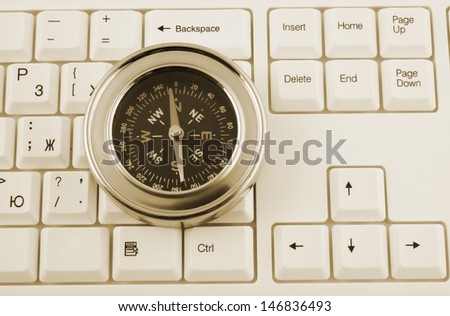 Computer keyboard and compass, business concept