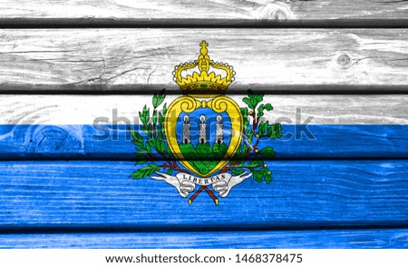 San marino flag painted on wooden background, closeup.