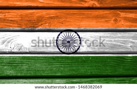 India flag painted on wooden background, closeup.