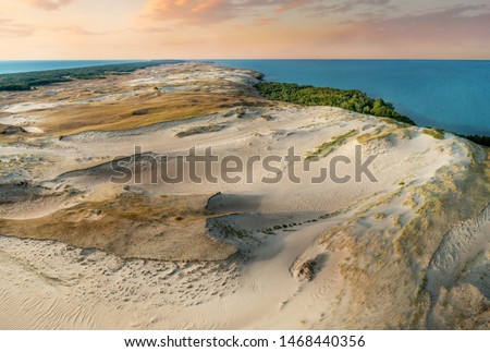 The Curonian Spit. Nida, Neringa, Lithuania. Gray Dunes, Dead Dunes. The Curonian Lagoon. Royalty-Free Stock Photo #1468440356