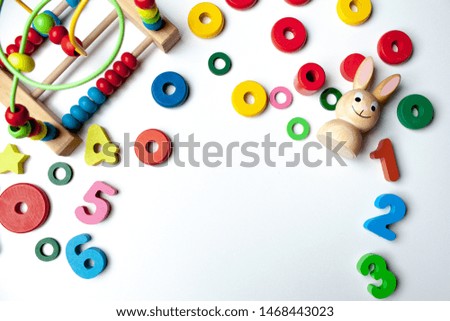 Kids toys frame on white background. Top view. Flat lay. Copy space for text