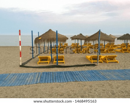 Evening beach umbrellas lying area