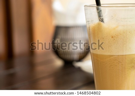 Bright picture with a cup of coffee. Time to have a break. Close-up. Nice brown colors. Place for text. Nice background. 