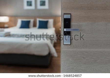 Hotel room , Condominium or apartment doorway with open door in front of blur bedroom background