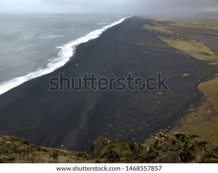 Black beach in Dyrhoaley Iceland
