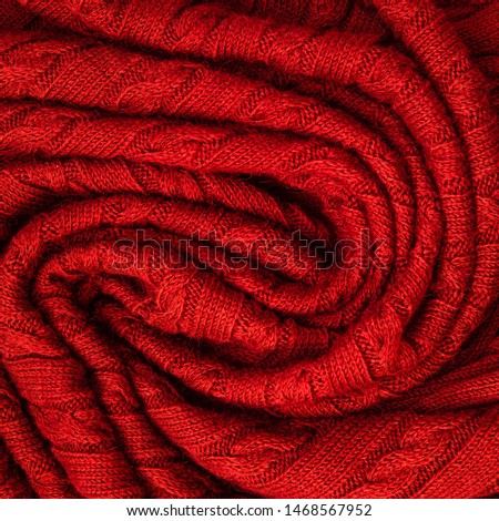 Background made of knitted ornament texture. Macro photo.