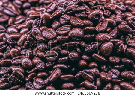 Dark Coffee beans. Isolated vintage style. Roasted Dark coffee beans background.roasted coffee beans, can be used as a background.