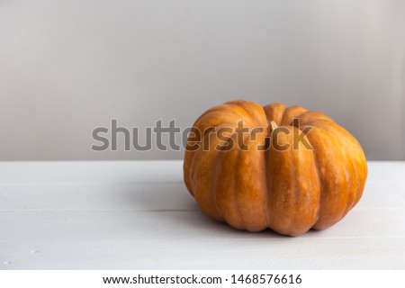 Pumpkin Autumn Halloween concept On white table