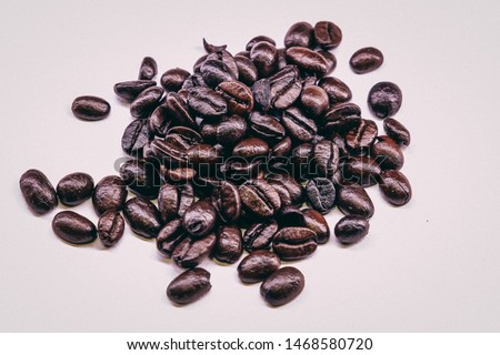Dark Coffee beans. Isolated vintage style. Brown roasted coffee beans, seed on dark background. Espresso dark, aroma, black caffeine drink. Closeup isolated energy mocha, cappuccino ingredient.