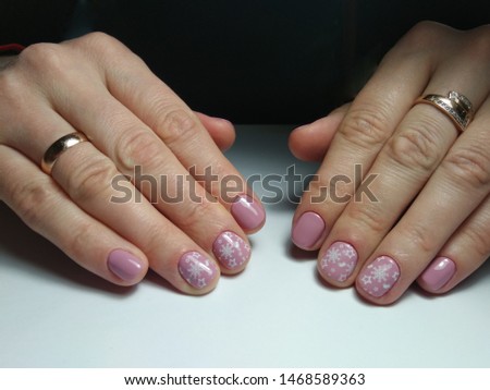 Natural nails. The nails are covered with gel. Beautiful Christmas designs.