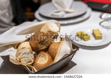 Bread Basket on Set Kitchen Table with butter