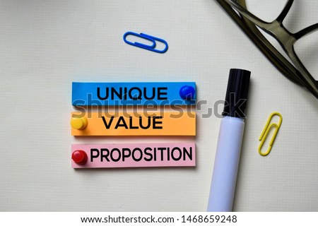 Unique Value Proposition - UVP text on sticky notes isolated on office desk