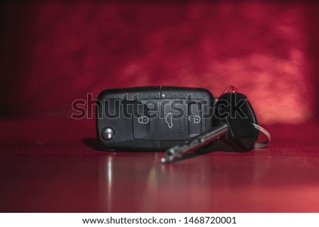Close up photo of car keys standing on table