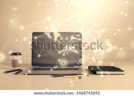 Technology theme hologram and desktop office computer background. Double exposure. Concept of high technology