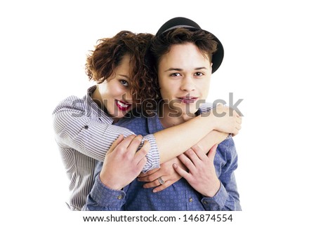 Smiling brother and sister portrait, casual clothing,embraced, half body portrait, isolated on white, studio shoot.