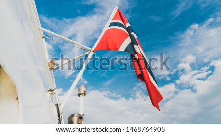 The flag of Norway on a mast