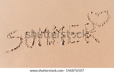 Summer word written on beach yellow sand
