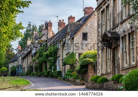 Quaint Cotswold romantic stone cottages on The Hill,  in the lovely Burford village, Cotswolds, Oxfordshire, England  Royalty-Free Stock Photo #1468776026