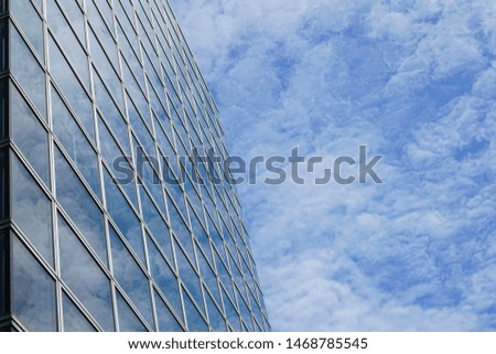 Business tower with sky and cloud. Skyscrapers with clouds reflection.