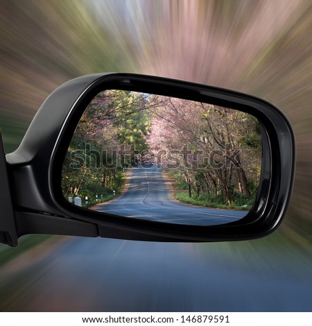 Car Mirror on The Road with Concept of Speed