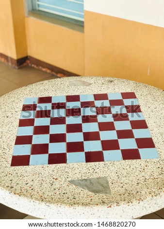 Checkers table on the marble table