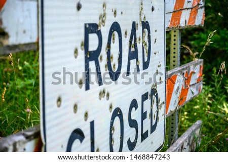 Buckshot road closed sign in front of a washed out bridge