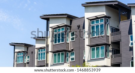 Exterior view of multifamily residential building; Menlo Park, San Francisco bay area, California Royalty-Free Stock Photo #1468853939