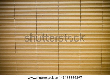Old yellow or beige with striped curtain nice texture pattern in row on the wall separate column,look like paper curtain in Japanese style ,good for a wallpaper background design