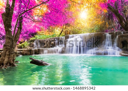Waterfall colorful leaves in the summer is a beautiful waterfall with clear, flowing water, soft, emerald green color, suitable for relaxing, playing,
