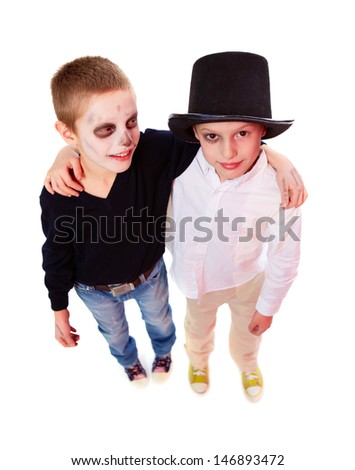 Photo of two Halloween boys looking at camera over white background