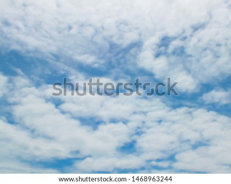Blue sky with clouds blurred subtle background, for background.