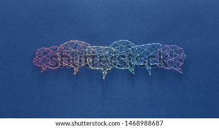 Social media concept. Network of pins and threads in the shape of many interconecting speech bubbles symbolising social dialog. Royalty-Free Stock Photo #1468988687