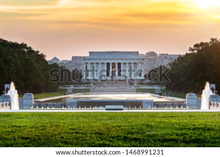 Lincoln memorial reflected on the reflection pool when sunset at nation mall, Washington DC, USA.