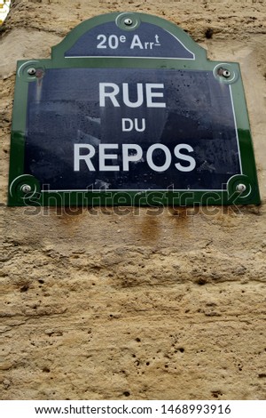Rue du Repos. (Street of rest). White and blue street name plate. Paris, France.