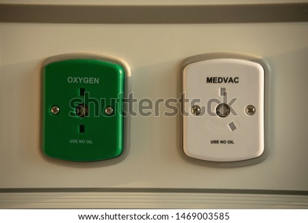 Oxygen supply system and medical vacuum sources for use in negative pressure wound therapy installed on the wall of hospital admission room.