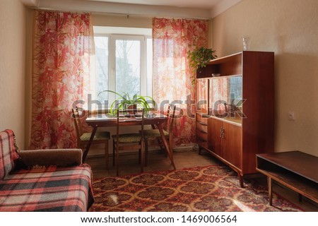 Interior of typical soviet style apartment. Old furniture and retro design Royalty-Free Stock Photo #1469006564