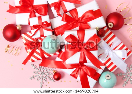 Set of beautifully wrapped gift boxes and Christmas decor on a colored background top view. Christmas gifts, Valentine's Day gifts. Holiday, give. Festive background
