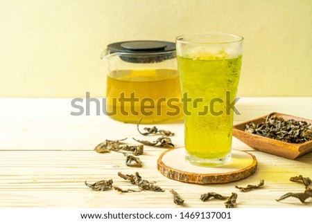 iced Japanese green tea on wood background