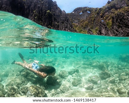 Tropical beach with blue water and palm trees - El Nido, Palawan, Philippines Royalty-Free Stock Photo #1469138417