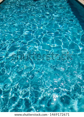 water with sun reflections in a swimming pool