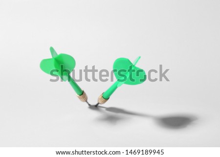 Green dart arrows for game on white background, above view
