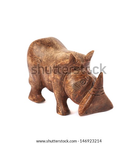 Rhinoceros rhino sculpture made of carved brown wood isolated over white background