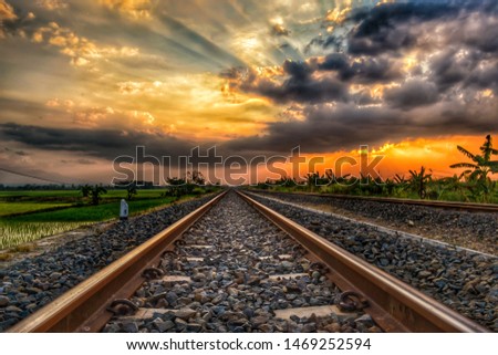 sunset in the rail road . take with nikon d3100 kitt lens Royalty-Free Stock Photo #1469252594