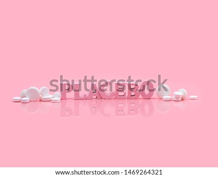 white Pills and word "placebo" on pink background. Placebo effect, fake medical treatment. minimal creative concept. copy spase