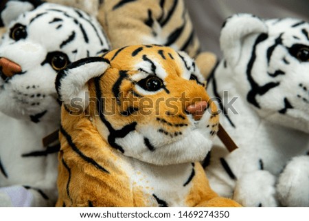 Closeup beautiful cute black and white , yellow tiger dolls